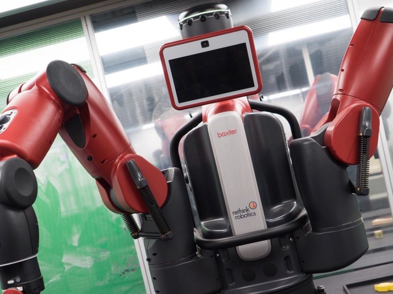 A manufacturing robot with two "arms" and a central screen.